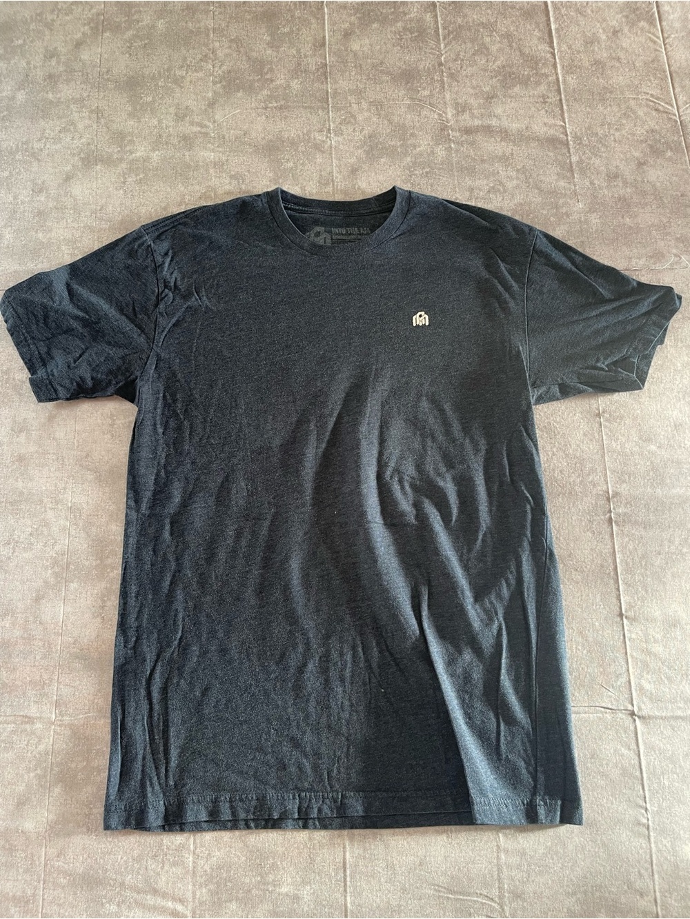 Men's Black Crewneck Tee with Minimal Chest Emblem